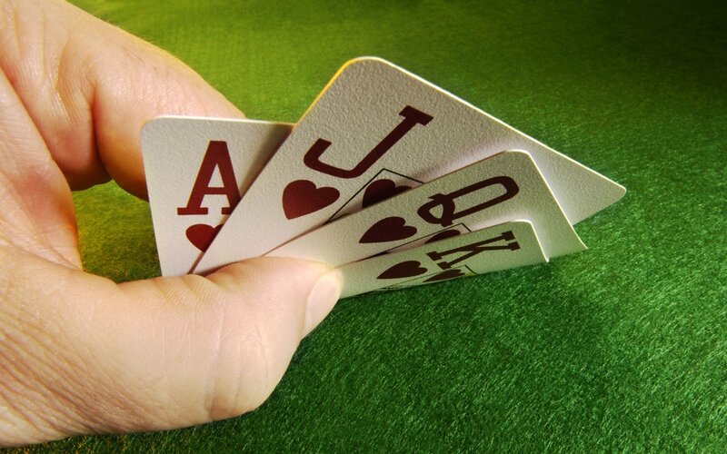 Hand Holding Cards — Green