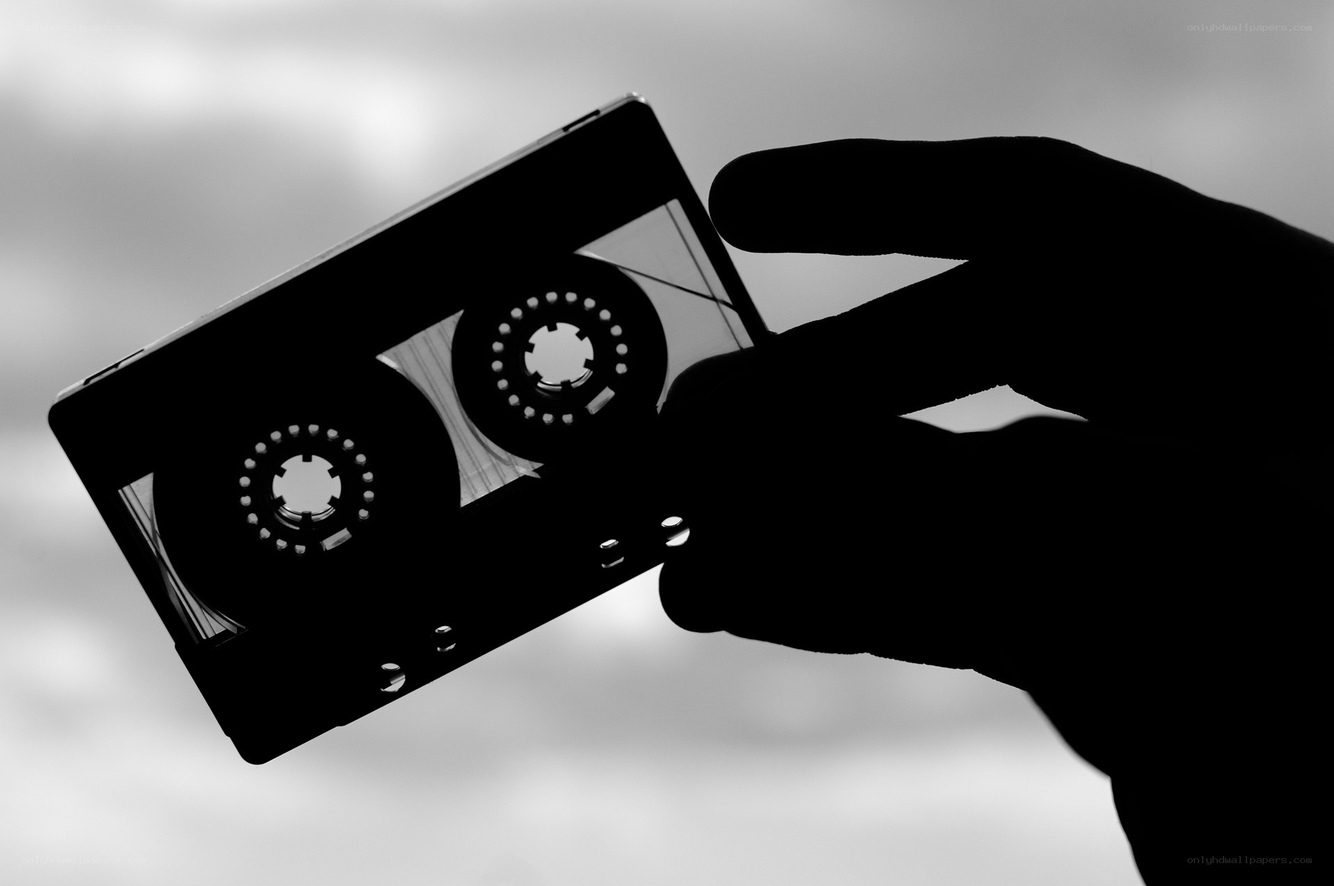 hand holding cassette tape