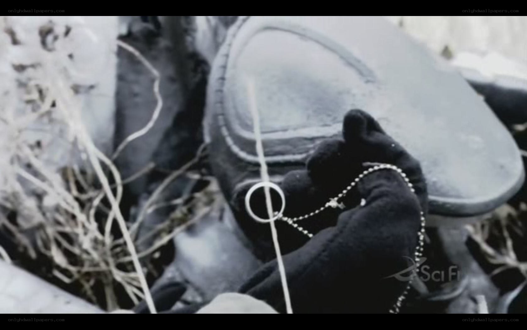 hand holding chain in snow