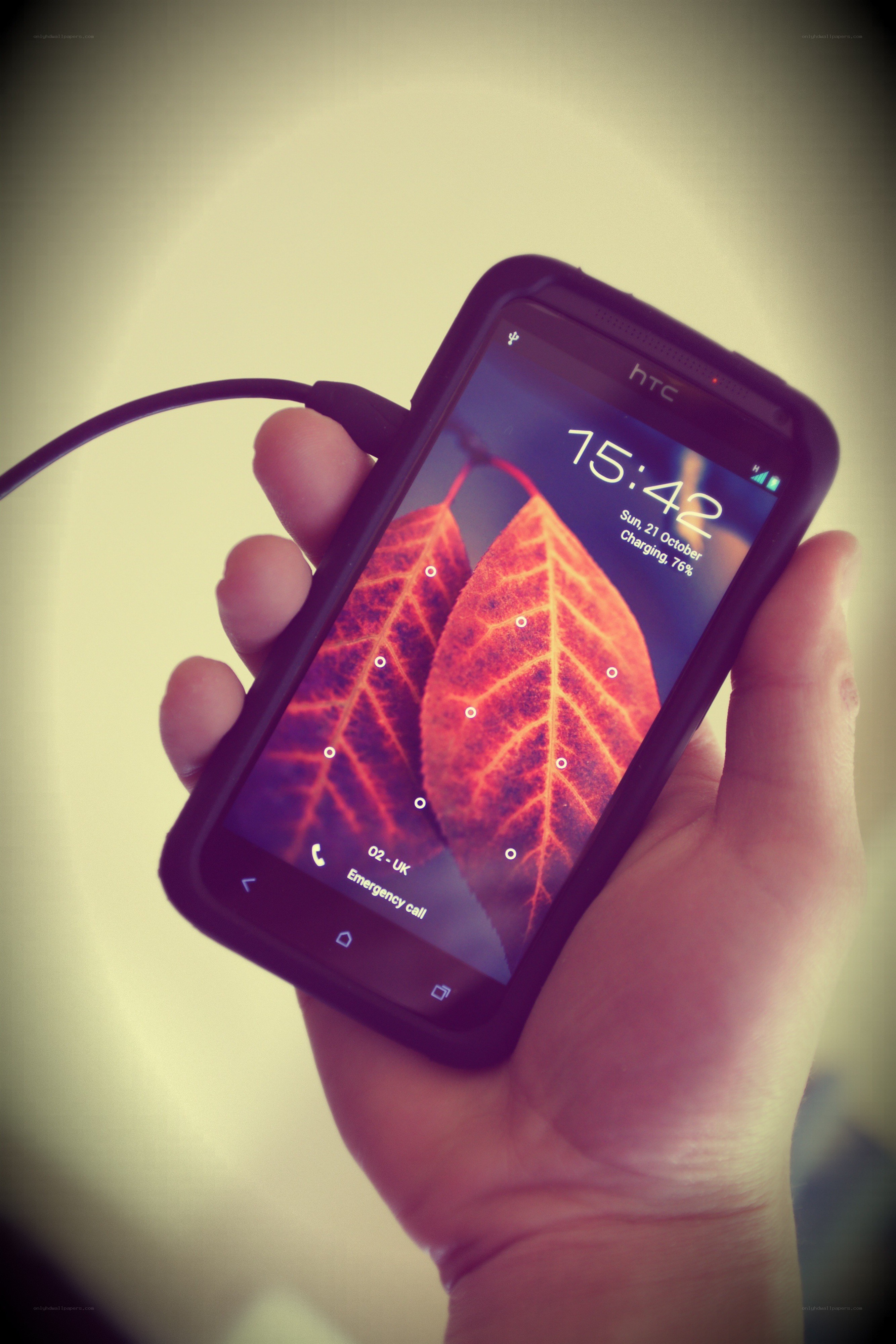 hand holding charging smartphone