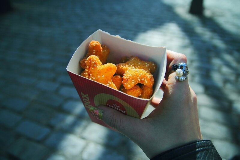 hand holding chicken nuggets