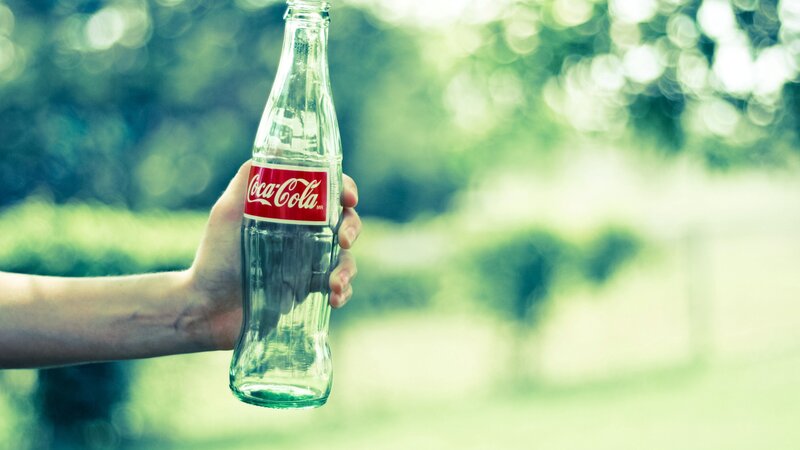 Hand Holding Coca-cola Bottle — Green