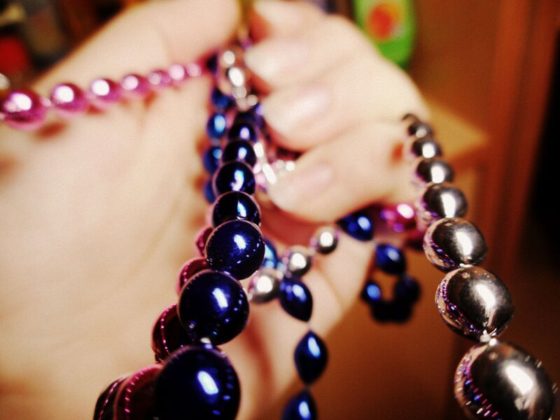 hand holding colorful beads