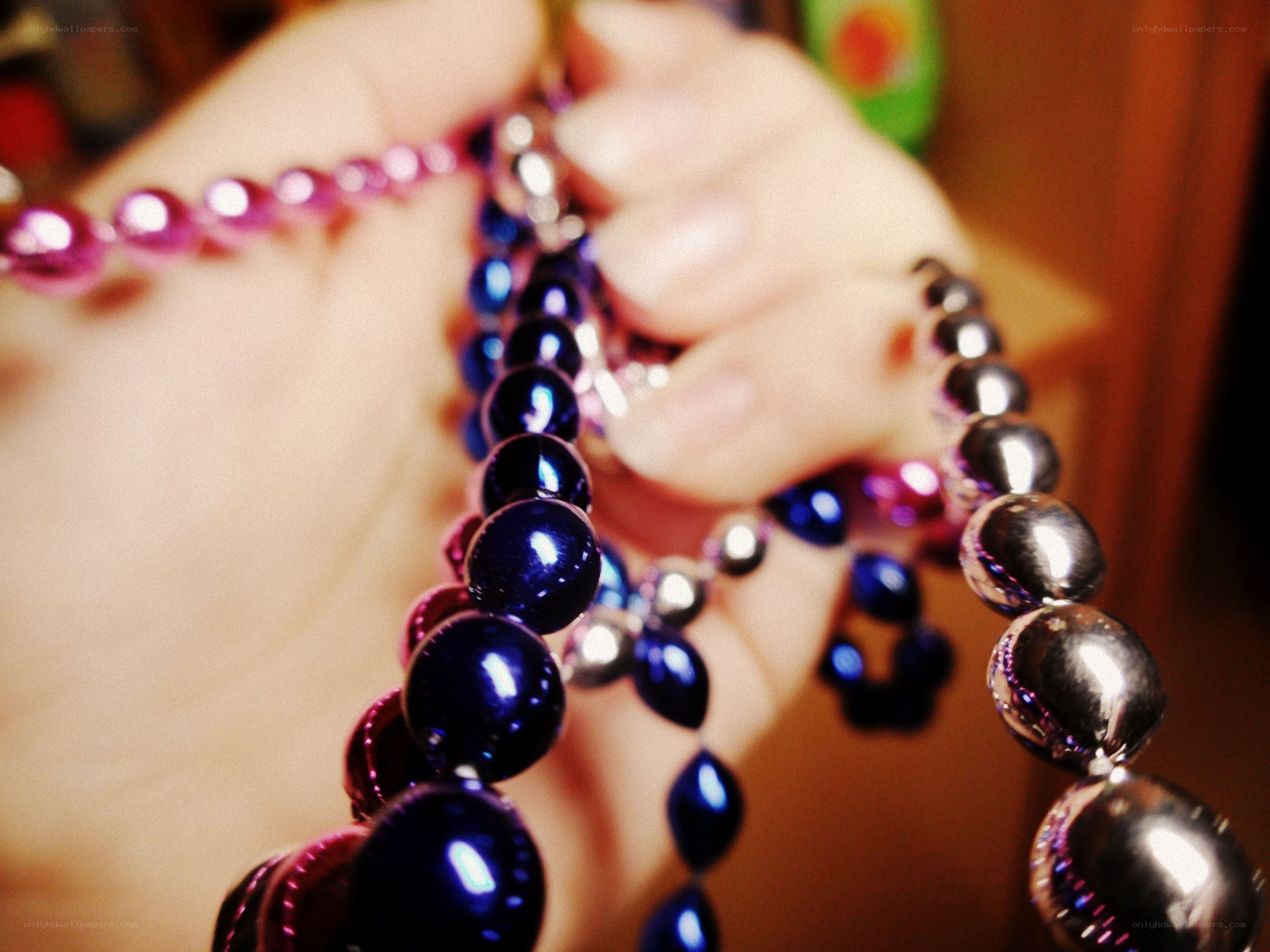 hand holding colorful beads