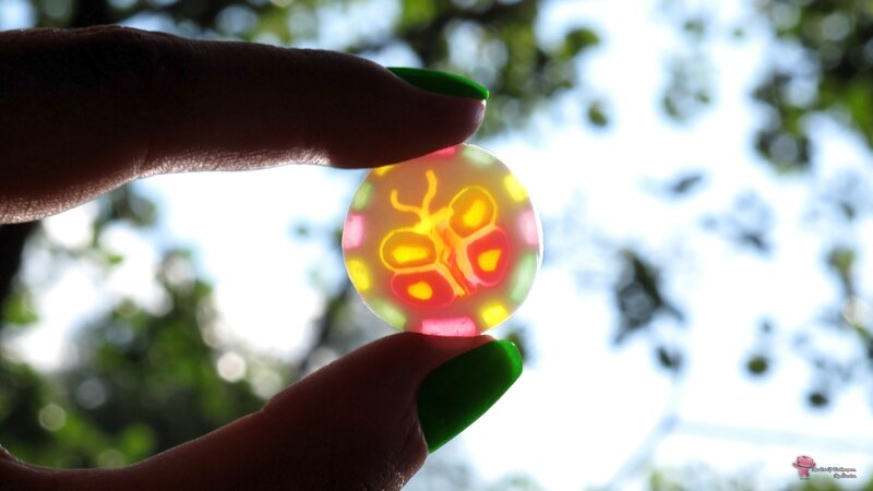 hand holding colorful glass bead