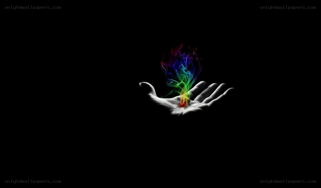 hand holding colorful smoke