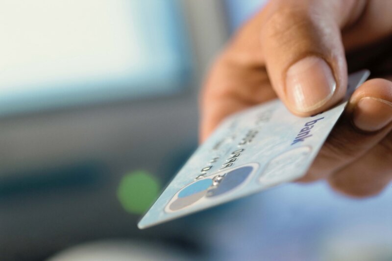 hand holding credit card