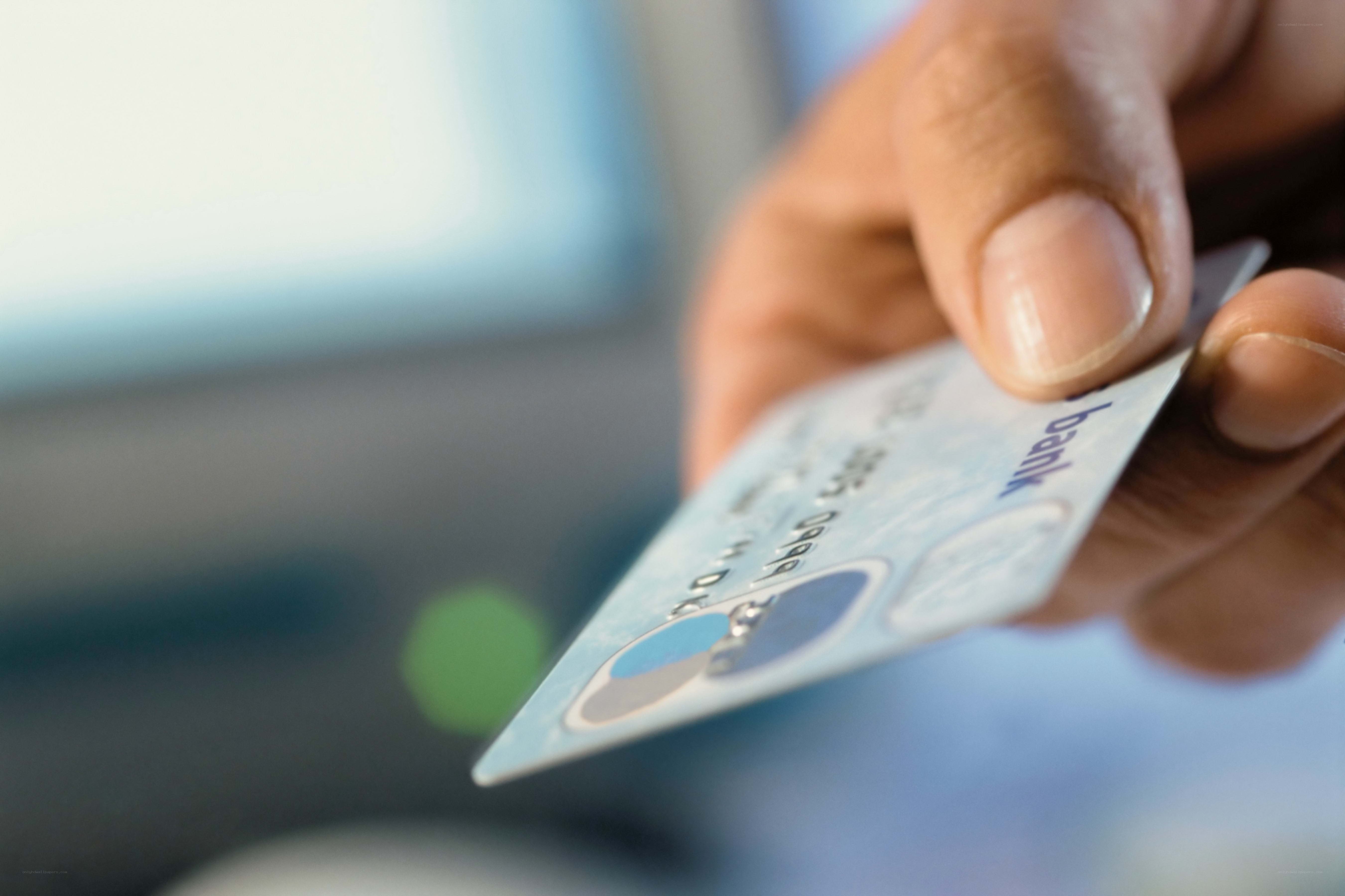 hand holding credit card
