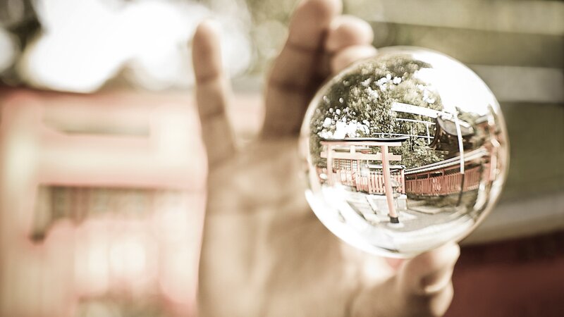 Hand Holding Crystal Ball — Sepia