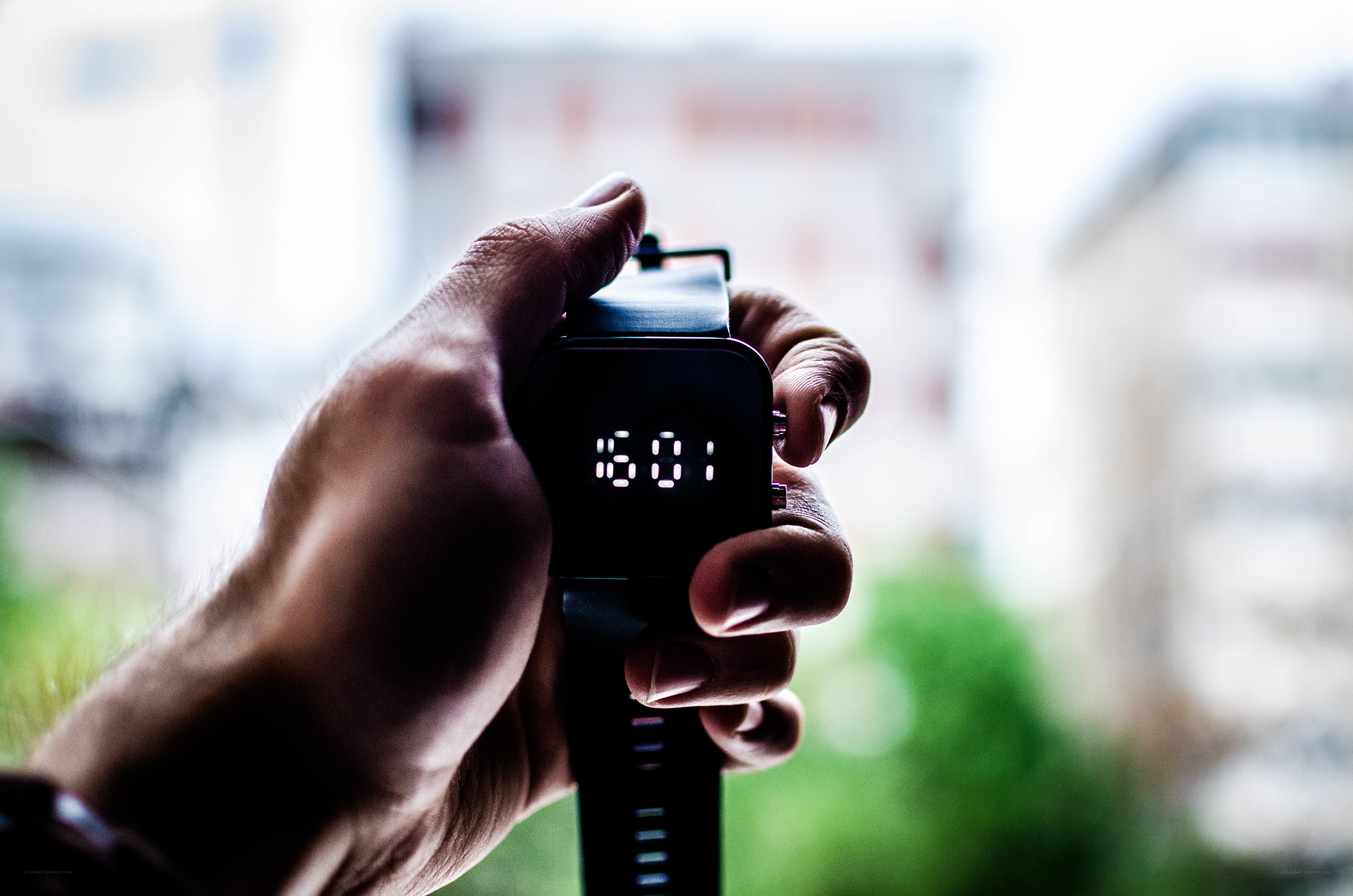 hand holding digital watch