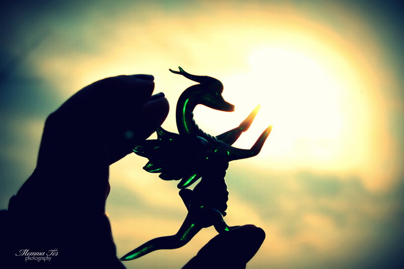 Hand Holding Dragon Figurine