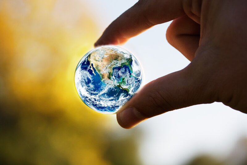 Hand Holding Earth Globe — Blue, Serene