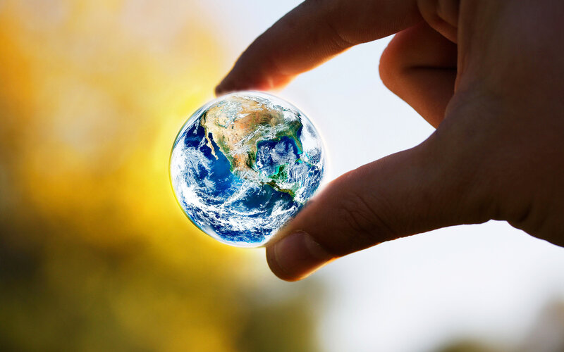 Hand Holding Earth Globe — Blue