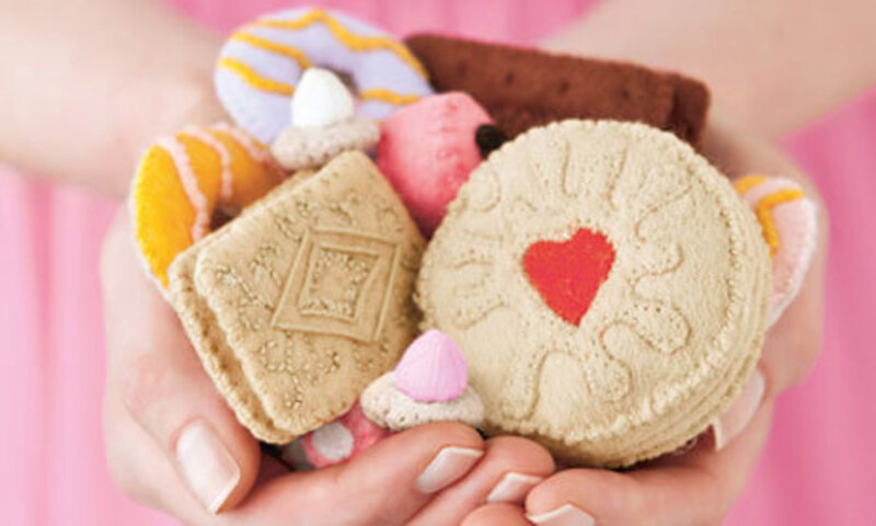 Hand Holding Felt Cookies