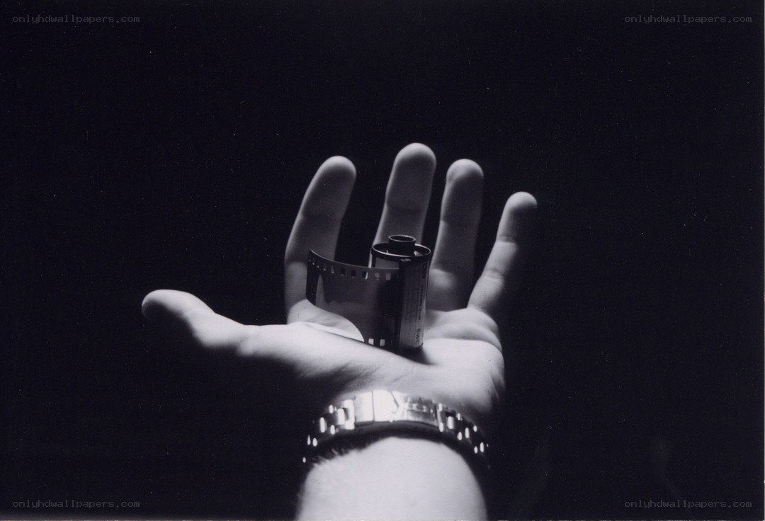 hand holding film roll