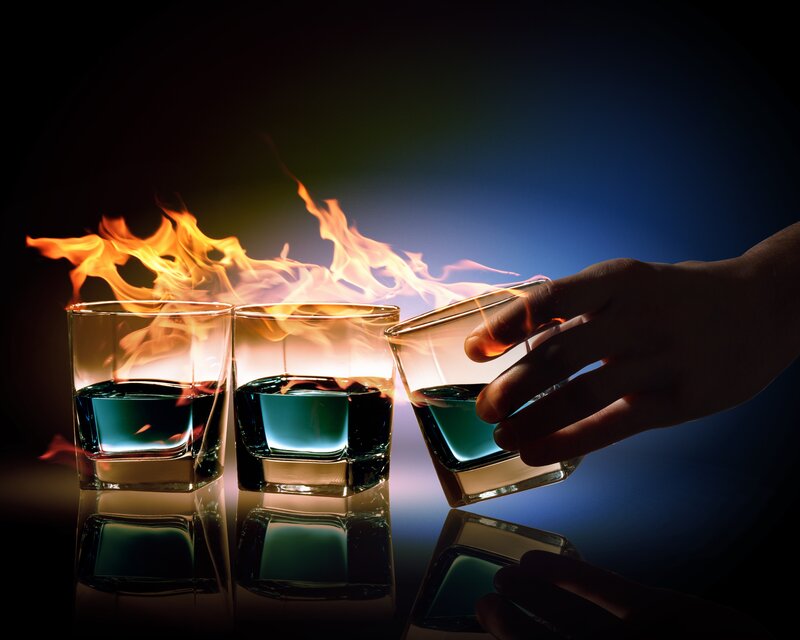 Hand Holding Flaming Glass — Blue
