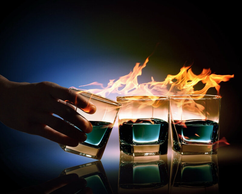 Hand Holding Flaming Glass