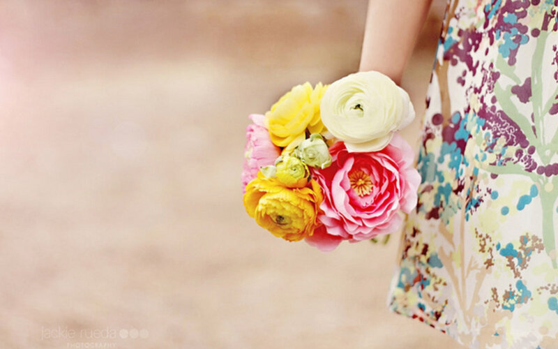 Hand Holding Flowers — Pink