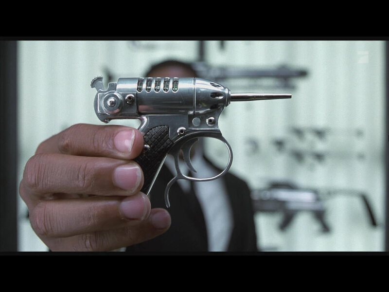 hand holding futuristic gun