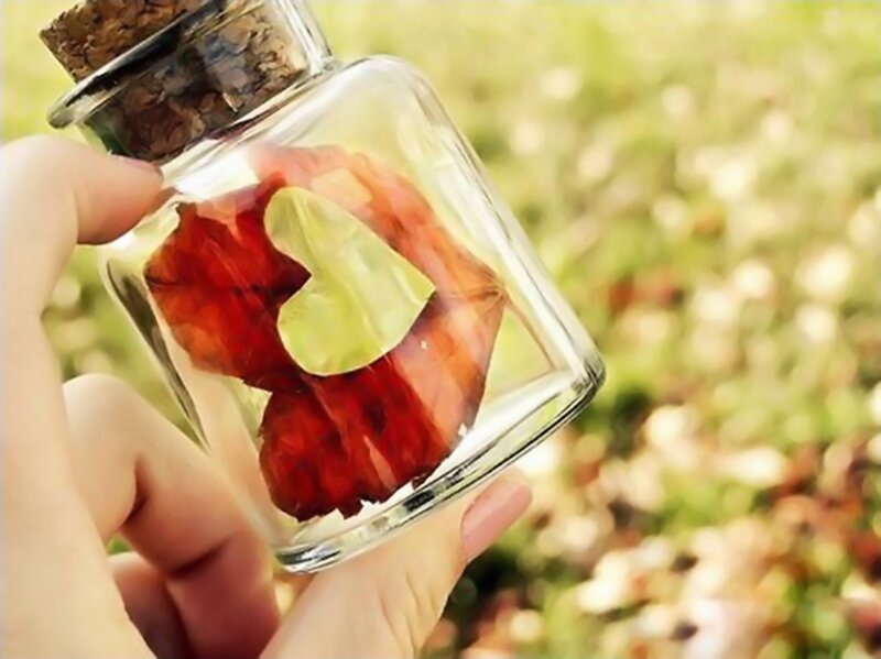 Hand Holding Glass Jar
