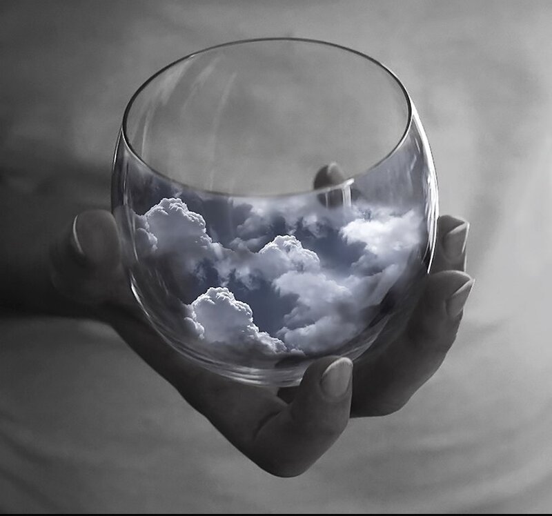 Hand Holding Glass with Clouds — Black