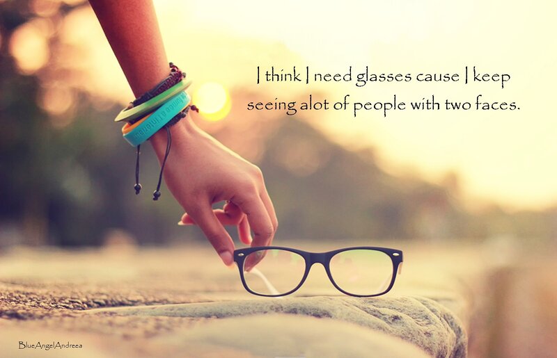 Hand Holding Glasses