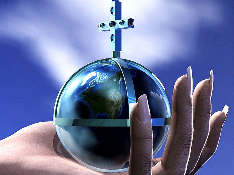 hand holding globe with cross