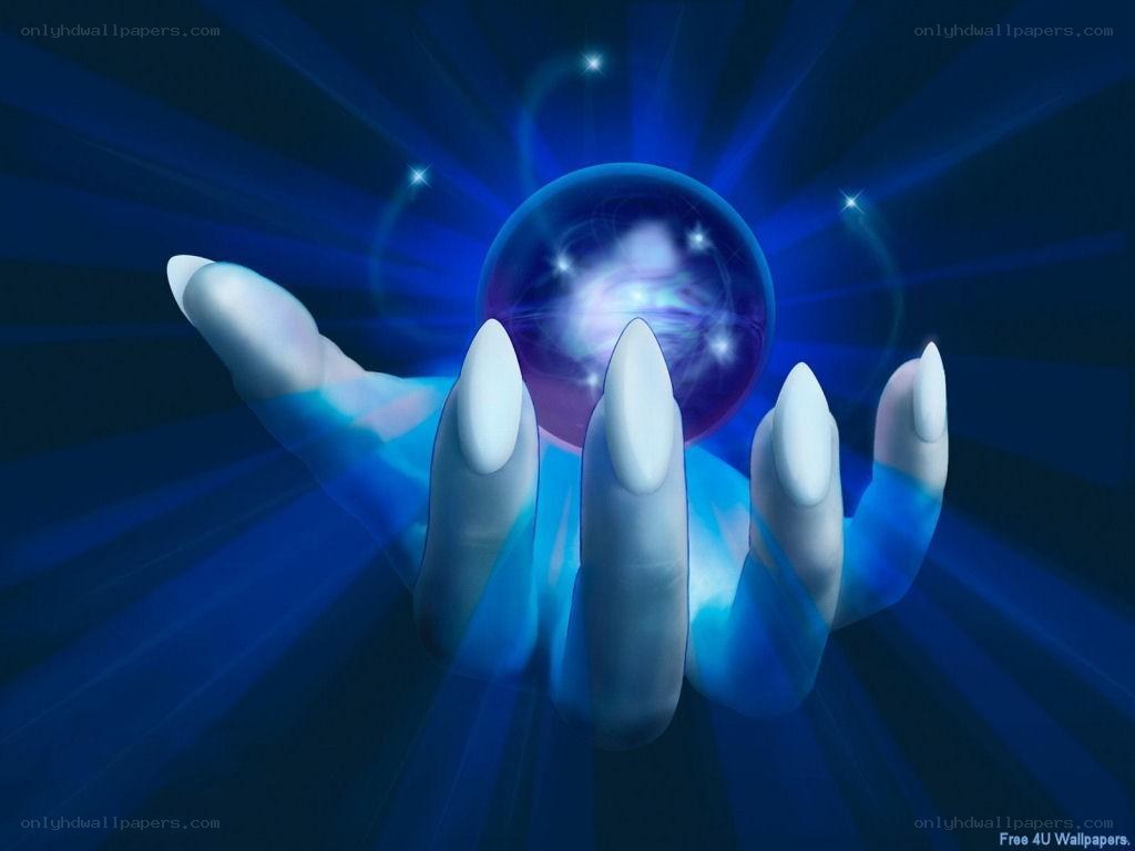 hand holding glowing crystal ball