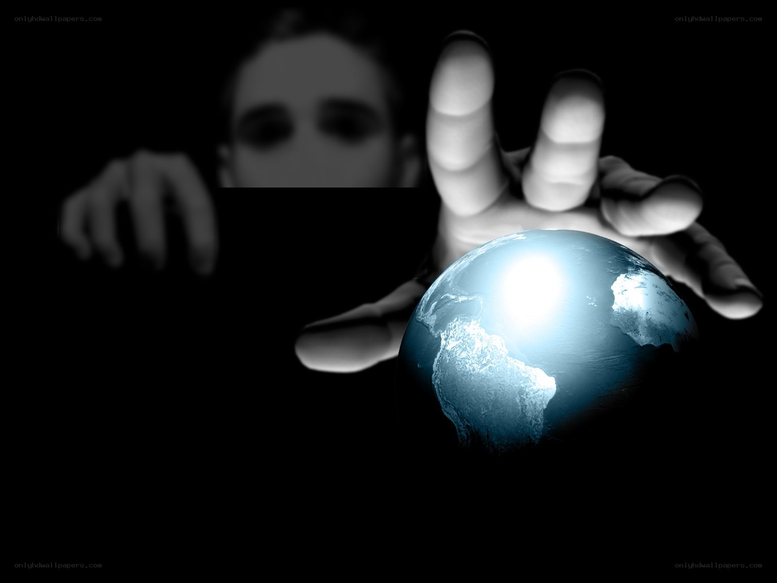 hand holding glowing earth