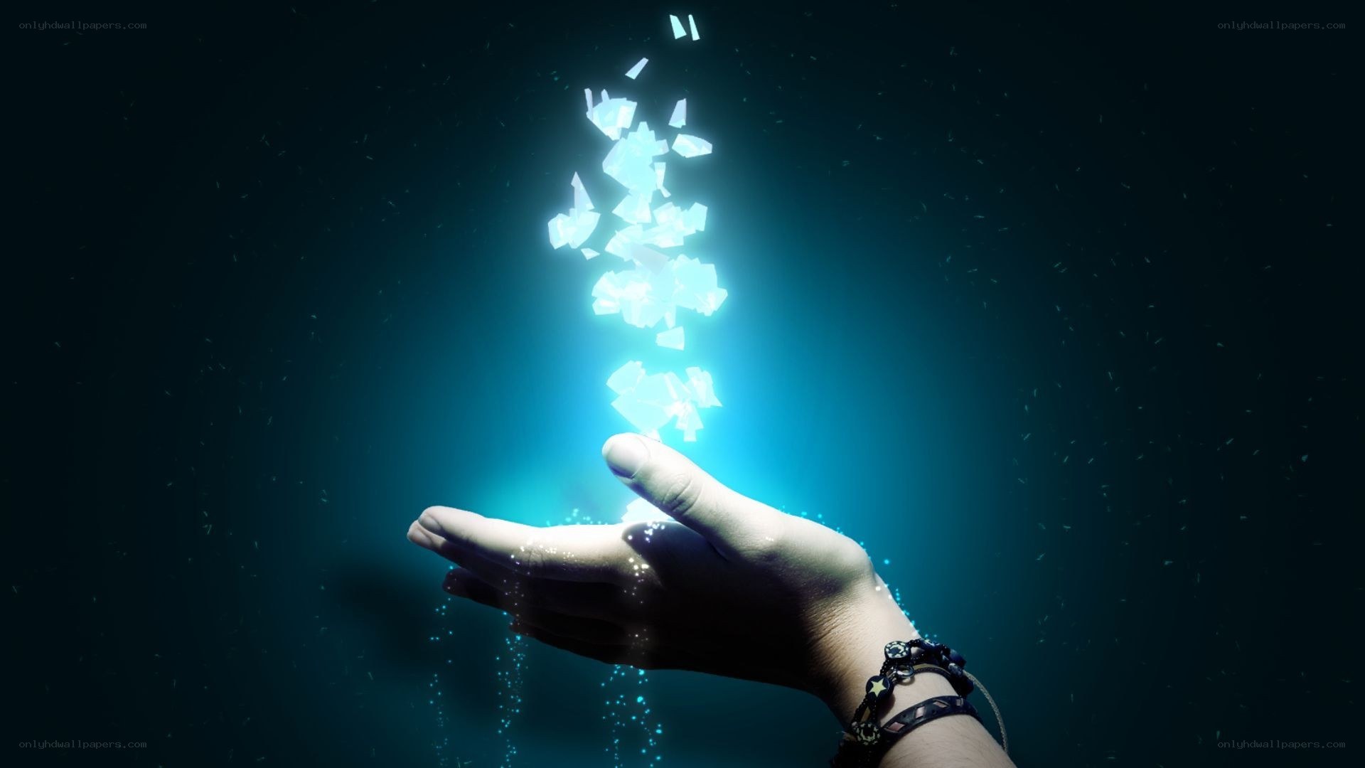 hand holding glowing fragments