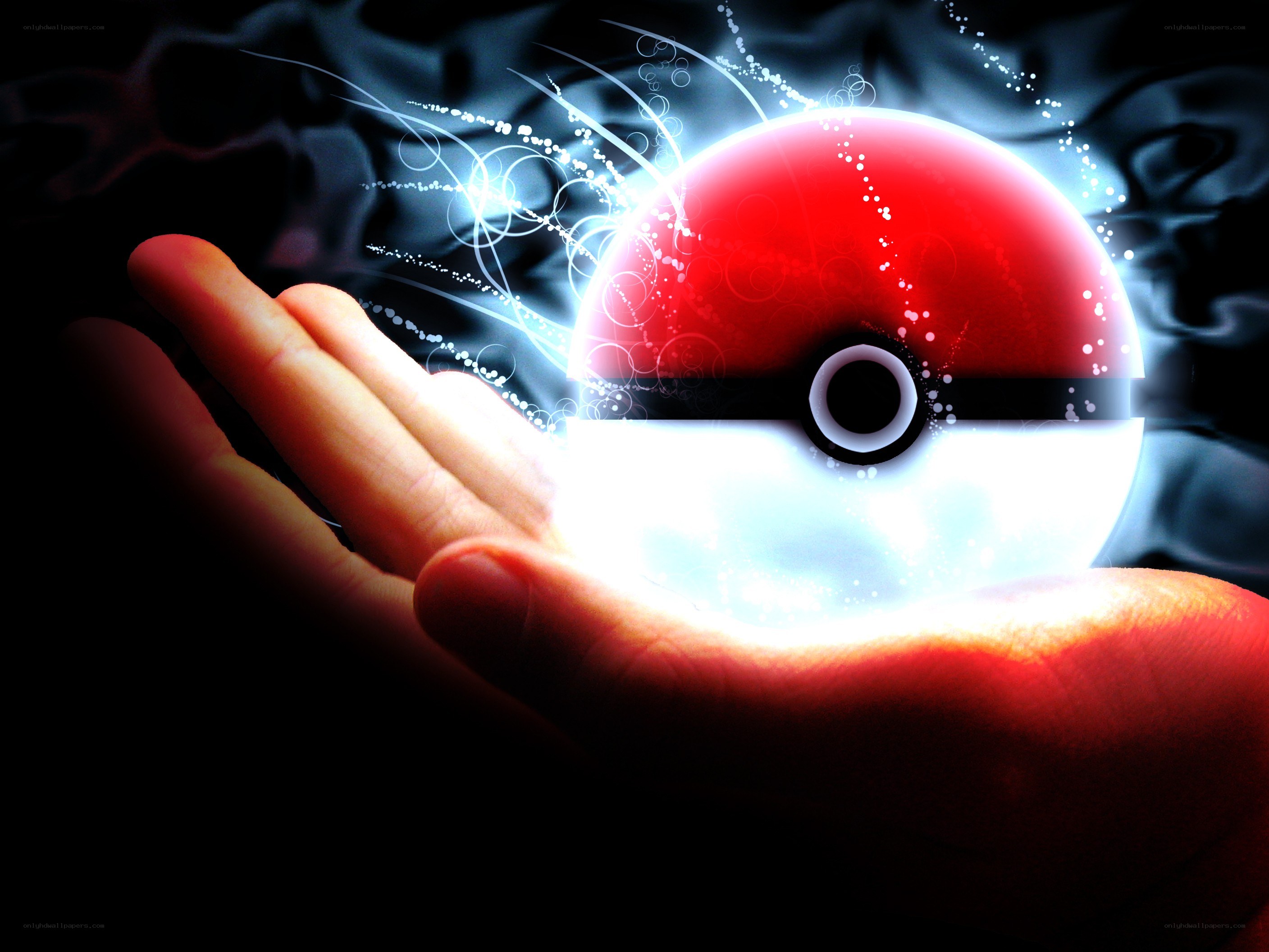 hand holding glowing pokeball