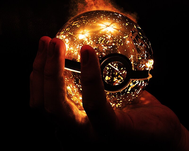 Hand Holding Glowing Sphere — Black, Dramatic