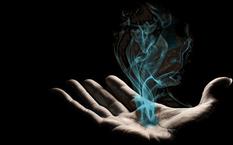 hand holding glowing spirit