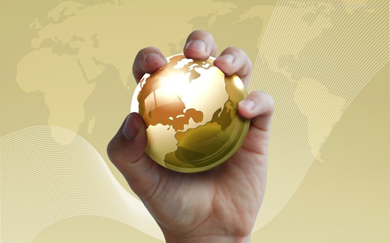 hand holding golden globe
