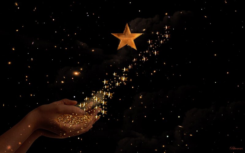 Hand Holding Golden Stars