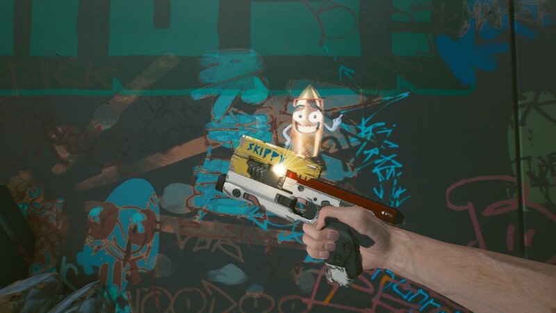 Hand Holding Gun with Bullet