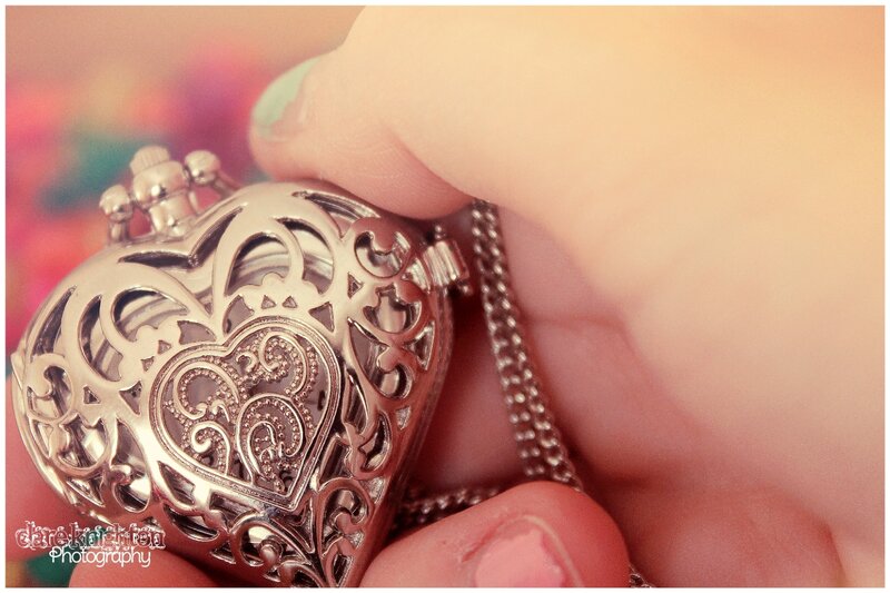 Hand Holding Heart Locket