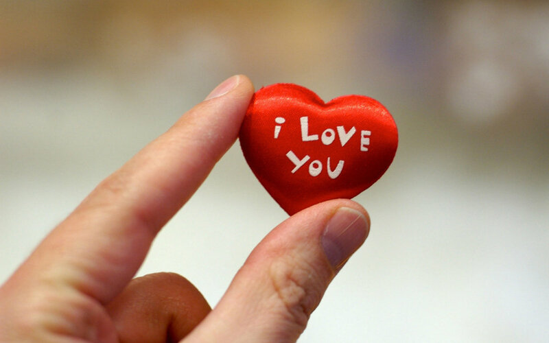 Hand Holding Heart — Red