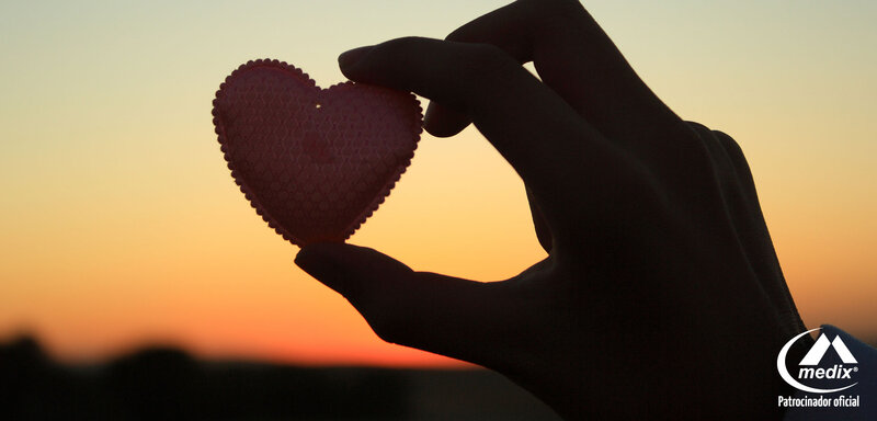 Hand Holding Heart Shape — Orange