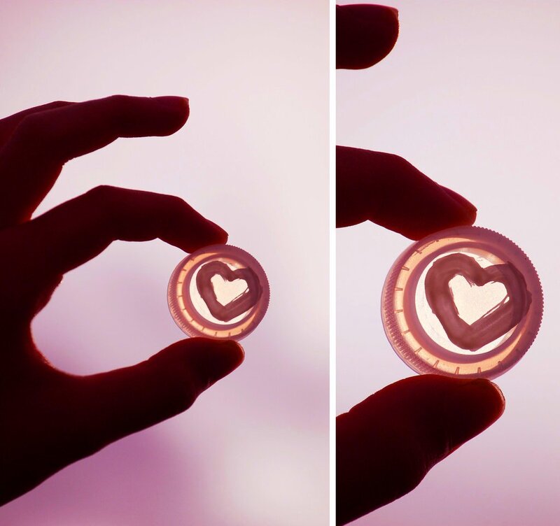 Hand Holding Heart-shaped Object — Purple