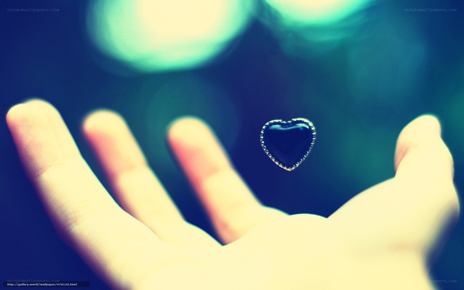 hand holding heart symbol