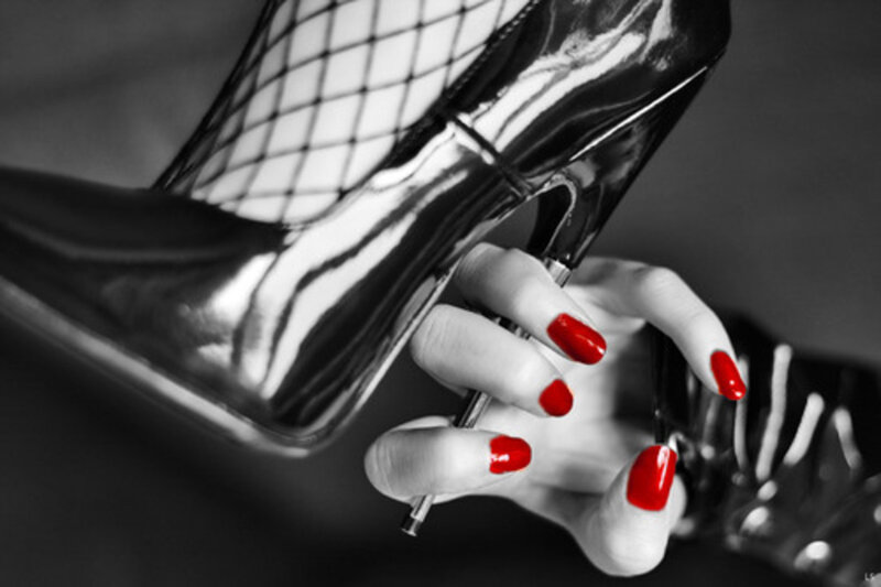 Hand Holding High Heel — Black