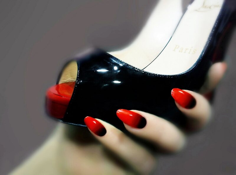 Hand Holding High Heel