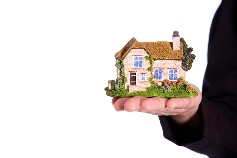 Hand Holding House Model — White