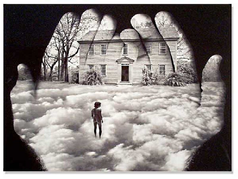 hand holding house scene