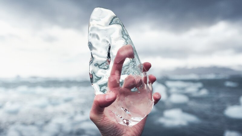 Hand Holding Ice Chunk