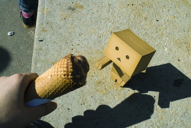 Hand Holding Ice Cream Cone — Brown