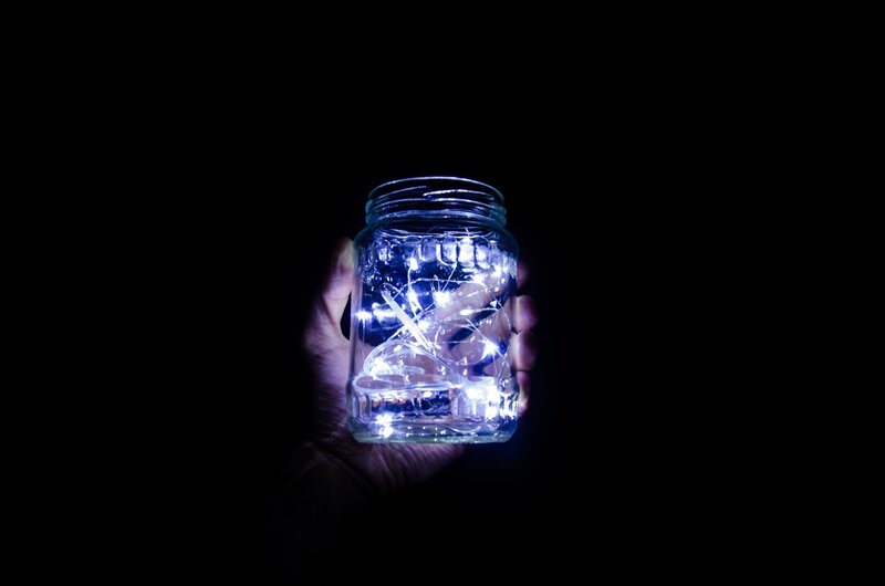 Hand Holding Jar with Lights