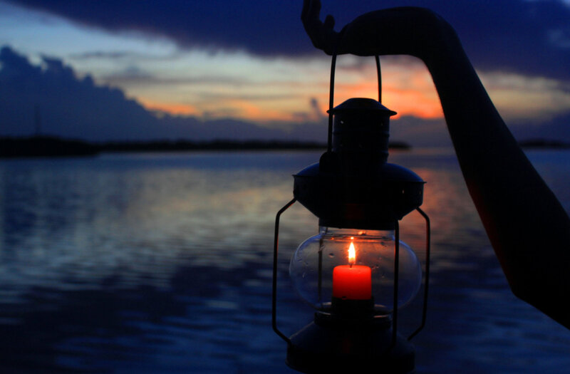 Hand Holding Lantern — Blue