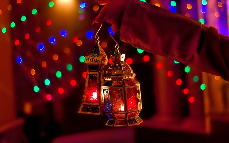 Hand Holding Lanterns